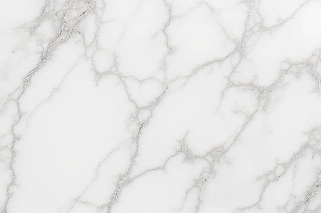 Close-up of a luxurious, veined marble slab, ready for carving
